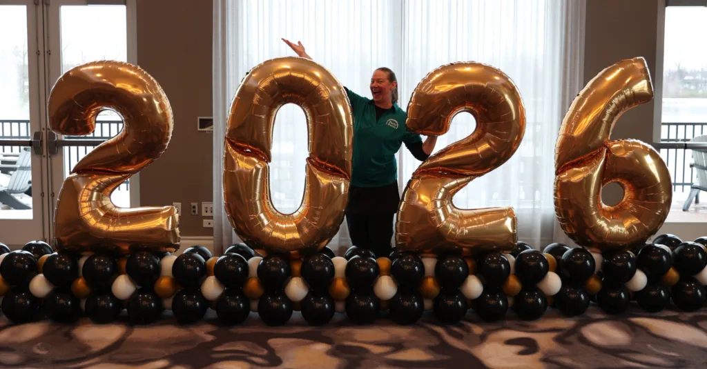 2026 New Year’s Eve balloon marquee in gold and black created by Party Perks for NYE event décor in St. Louis