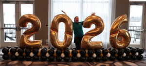 Large 2026 graduation balloon numbers in St. Louis with custom black and gold balloon styling for a school celebration.