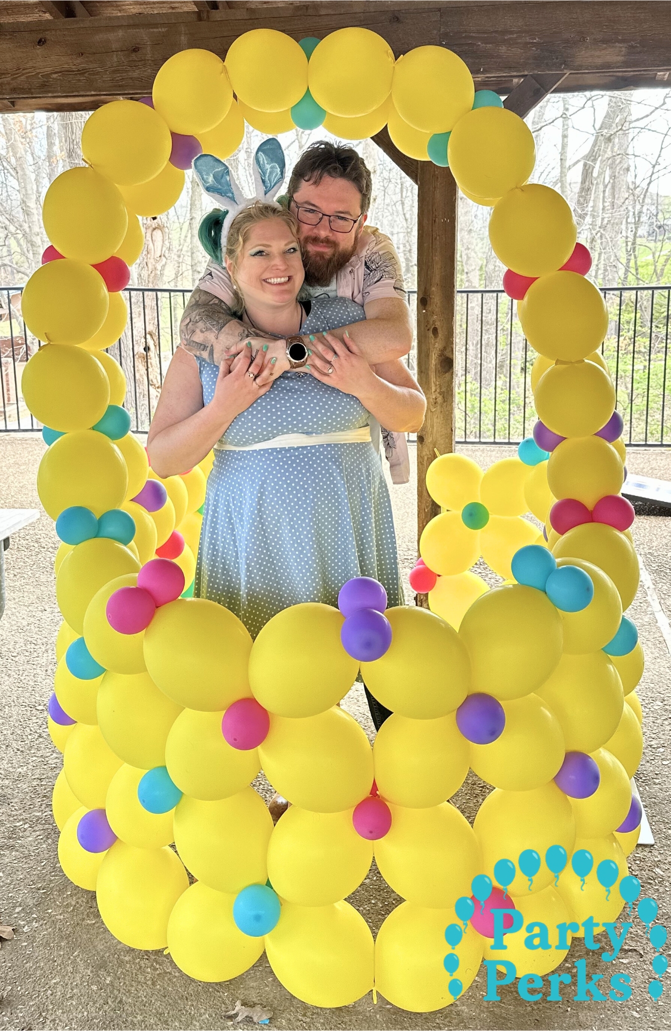 Yellow Easter balloon basket photo frame with pastel accents, created by a balloon decorator in Wildwood, MO.