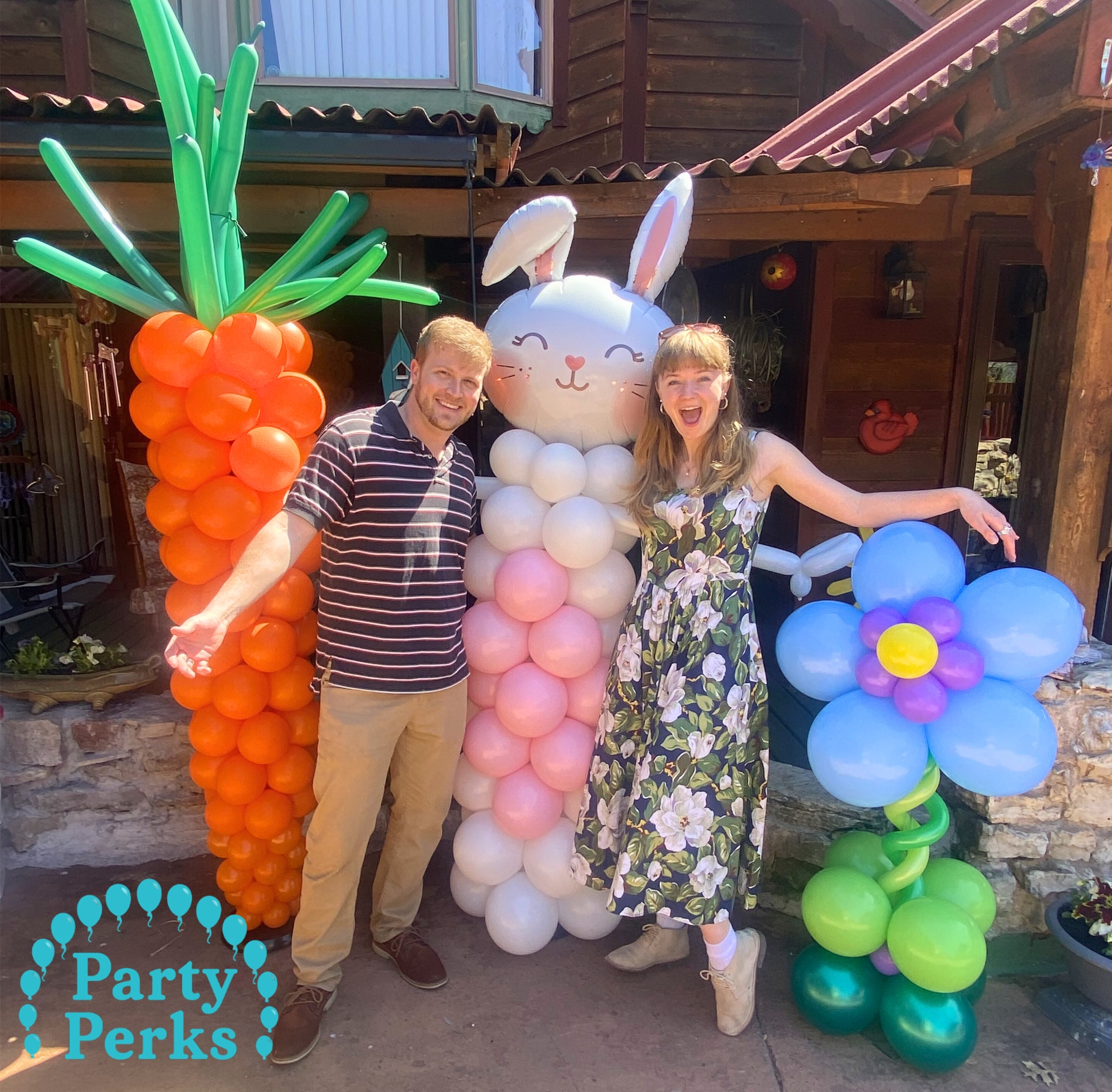Easter balloon decorations with bunny balloon column and carrot balloon display, created by a balloon decorator in Greater St. Louis, MO