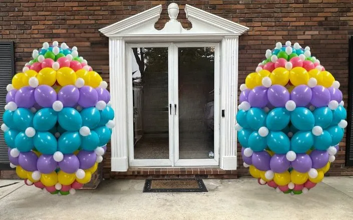 Large Easter balloon egg decorations displayed at a front entrance in Greater St. Louis, MO by a professional balloon decorator