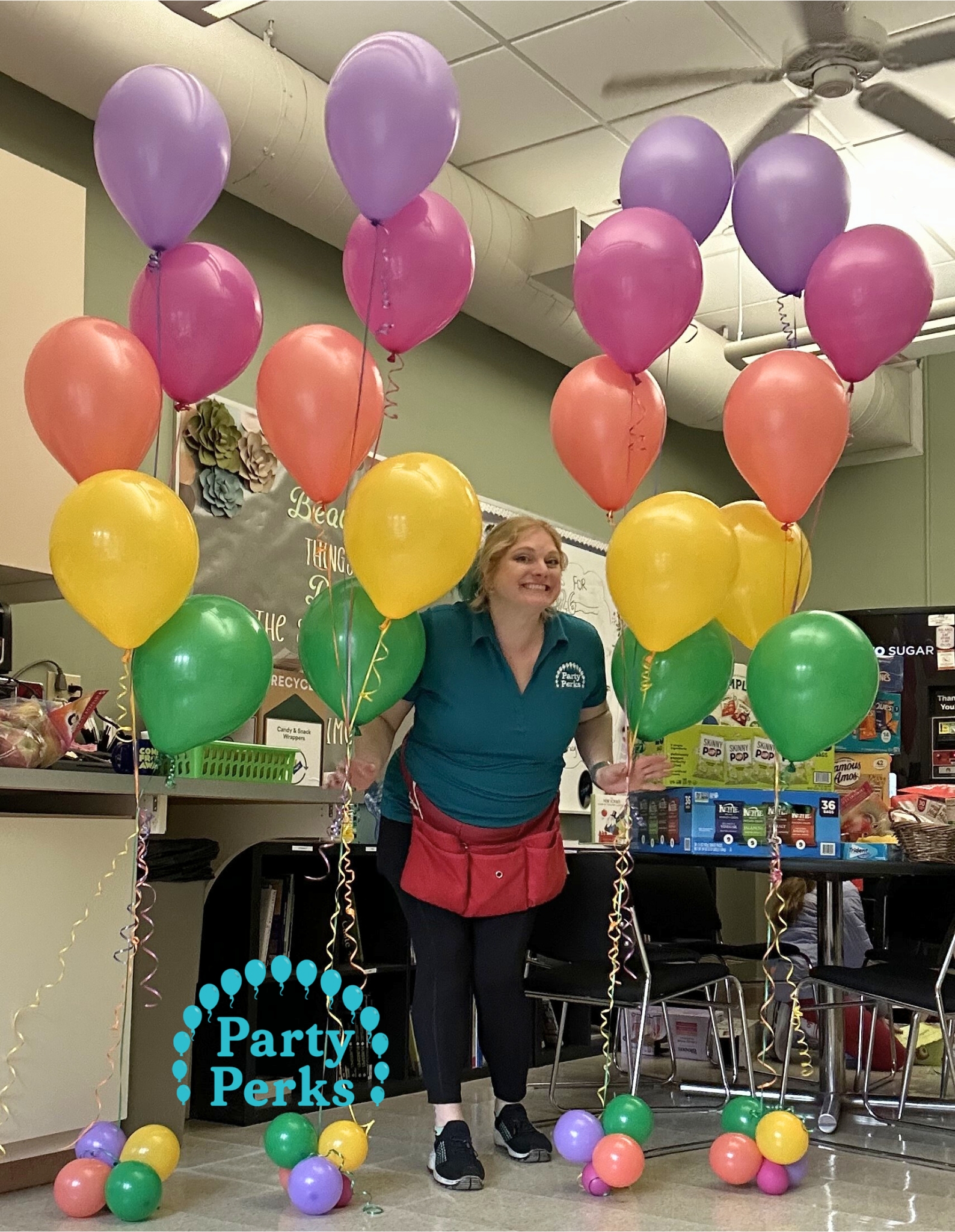 Easter Helium Balloons Ladue MO w logo Easter balloon decorations with colorful helium balloons arranged for a Faculty Appreciation week at Community School in Ladue, MO by Party Perks.