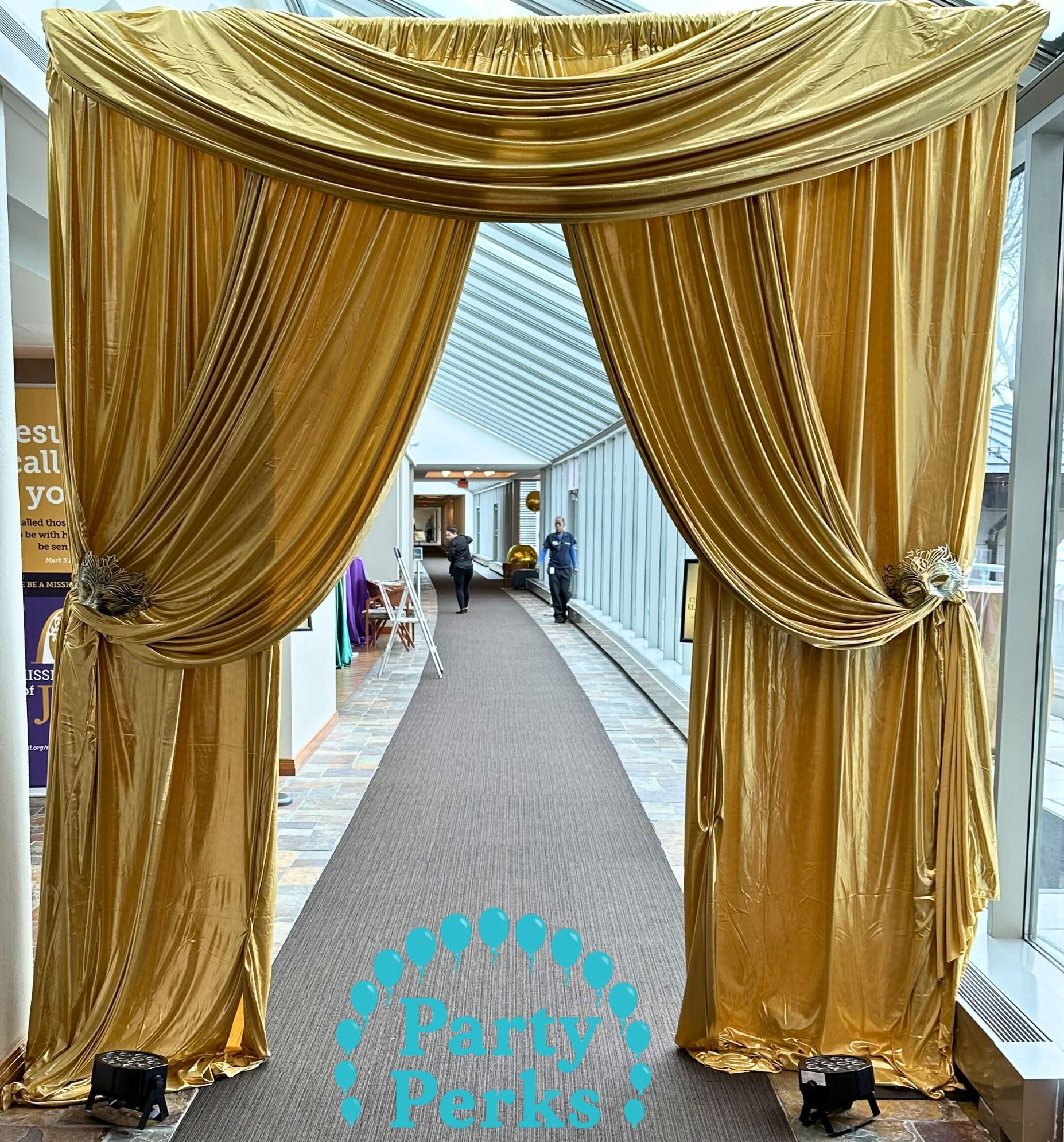 cropped-mardi-gras-pipe-and-drape-st-louis.jpg Gold drape entrance decor for a Mardi Gras event in the St. Louis area creating a dramatic entrance for guests at a themed celebration.